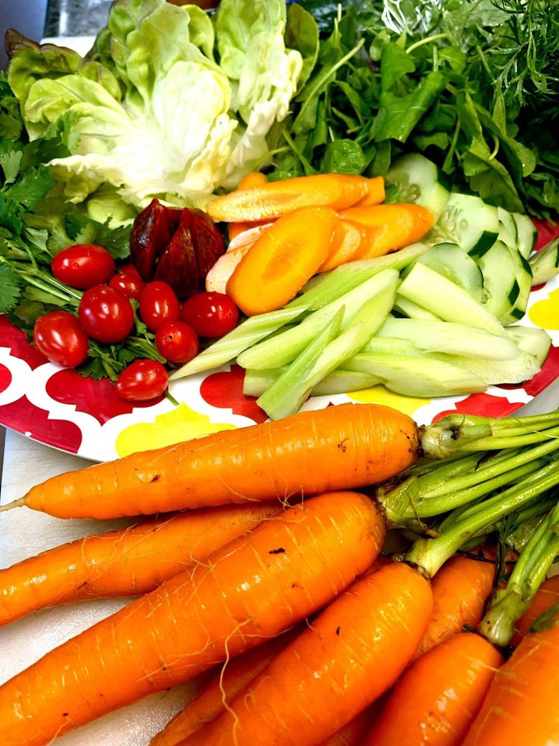 Fresh carrots, lettuces, tomatoes, cucumber and herbs