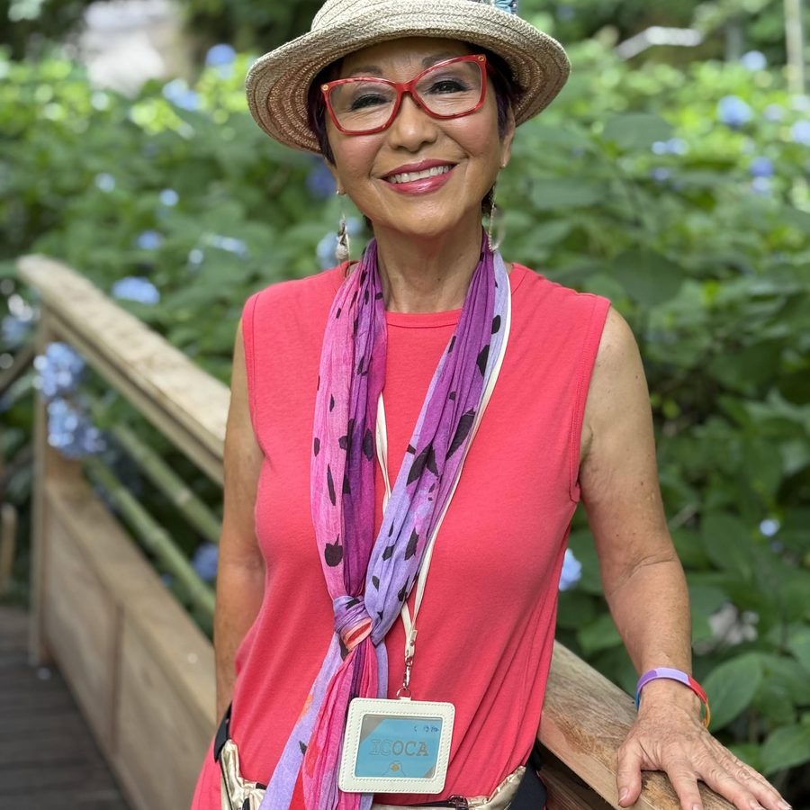 Olelo paʻa smiling in a lush garden